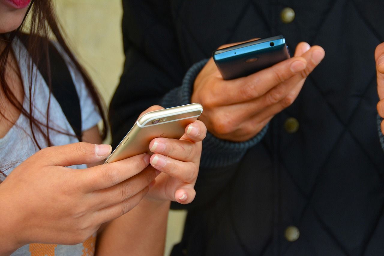 People texting on their smartphones